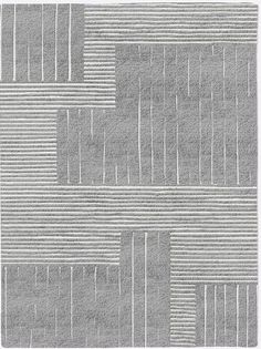 a gray rug with white lines on the top and bottom, in an abstract pattern