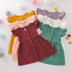 Material: Cotton,Polyester Gender: Girls Fit: Fits true to size, take your normal size Dresses Length: Knee-Length Decoration: Ruched Collar: Crew Neck Size(inch): 80 Bust: 20.1 Length: 17.7 Age: 12-24 Months 90 Bust: 20.9 Length: 19.7 Age: 2-3 Years 100 Bust: 21.7 Length: 21.3 Age: 3-4 Years 110 Bust: 22.8 Length: 22.8 Age: 4-5 Years 120 Bust: 24.0 Length: 24.4 Age: 5-6 Years Friendly Tips: 1.Please kindly allow 2-3% difference according to manual measurement. 2.Please check the measurement cha Cute Solid Color Dress For Dress-up, Cute Solid Dresses With Ruffle Hem, Summer Dress-up Dresses With Buttons, Spring Dresses For Playdate, Solid Color Dresses With Ruffles In Cute Style, Cute Ruffle Sleeve Dress For Playtime, Cute Ruffle Sleeve Playtime Dress, Buttoned Dresses For Spring Dress-up, Casual Ruffle Sleeve Dress For Playdate