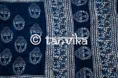 Presenting a range of light, breezy, and soft mul cotton Sarees which are perfect for the summers! This hand block printed saree is made on pure mul cotton in Indigo featuring the divine 'Buddha' prints. The soul of this saree lies in its comfort and ease of carrying. The gracecul zari border added to the saree makes it a perfect casual wear Saree for the day time! You can style this with crop tops or blouses, a messy bun, junk jewelry and mojris or flats! The print might have slight irregularit Traditional Blue Cotton Saree, Blue Cotton Dupatta With Printed Motifs, Blue Cotton Dupatta With Cutdana, Indigo Cotton Dupatta With Block Print, Blue Cotton Dupatta With Kalamkari Print, Blue Cotton Dupatta With Batik Print, Blue Cotton Saree With Printed Border, Festival Cotton Indigo Dupatta, Blue Kalamkari Print Mulmul Dupatta