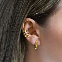 Elevate your style with this sculptural stud earrings. Designed to feel lightweight on your ears.| Lead and Nickel free.Sold as a PAIR Gold Vermeil (Thick layer of Gold plated over Sterling Silver) 17x7.5mm(0.7x0.2in) Push butterfly back closure #E462-G Modern Ear Cuff With Matching Earrings, Trendy Metal Ear Cuff With Matching Earrings, Modern Huggie Ear Cuff, Everyday Metal Single Ear Cuff, Modern Hypoallergenic Huggie Ear Cuff, Modern Adjustable Single Wrap Earring, Adjustable Modern Single Wrap Earring, Modern Metal Pierced Ear Cuff, Elegant Adjustable Metal Huggie Earrings