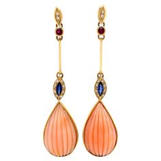 Simply Beautiful! Finely detailed and Diamond Drop Earrings set with Angelskin Coral, Sapphire, Ruby Diamonds weighing approx. approx. 0.12 Carats, suspending Angelskin Coral Drops, providing an amazing look! Hand crafted in 18K Yellow Gold. Measuring approx. 2.5” long. The earrings are in excellent condition and were recently professionally cleaned and polished. More Beautiful in real time! Chic and Classic…A Must Have sure to be admired Perfect accessory you'll turn to time and again! Drop Gold Earrings, Unusual Earrings, Sapphire Earrings, Diamond Drops, Ruby Diamond, Diamond Drop Earrings, Simply Beautiful, Earrings Set, Maquillaje De Ojos