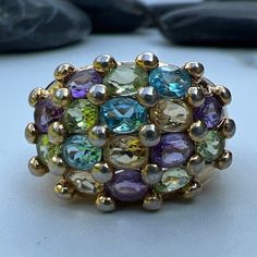 Gorgeous, Sparkling Multiple Peridot, Amethyst, Blue Topaz, and Citrine Gemstones set in 925 Sterling Silver Ring US size 5 3/4 Genuine Gemstones measure approximately 4mm x 3mm each Back of the Shank tapers down to 4mm Weighs approximately 6.6 grams. Stamped 925, THIALAND  This ring has a gorgeous face, however I have this ring priced much lower than I normally would due to some of the gold wash had faded on the shank of the ring. Peridot is the birthstone for August Amethyst is the birthstone for February  Blue Topaz is the birthstone for December Citrine is the birthstone for November Multicolor Amethyst Ring With Gemstone Accents, Multicolor Oval Amethyst Gemstone Ring, Multicolor Oval Amethyst Ring With Gemstone Accents, Multicolor Oval Amethyst Ring With Accent Stones, Multicolor Oval Amethyst Ring, Fine Jewelry Multi-stone Gemstones For Jewelry Making, Multicolor Amethyst Gemstone Ring, Multicolor Amethyst Ring Fine Jewelry, Multicolor Amethyst Ring With Gemstone Accents For Anniversary