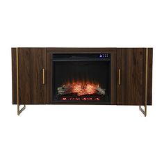 an entertainment center with a fireplace in the middle and flames on it's sides