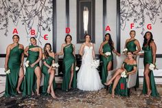 a group of women in green dresses posing for a photo