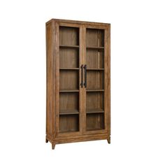 an oak bookcase with glass doors