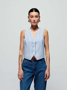 Maddie Vest - Parisian Blue Stripe | NATION LTD Classic Spring Vest For Daywear, Classic Cotton Tank Top For Work, Blue Cotton Tank Top For Work, Classic Denim Vest With Button Closure, Classic Spring Tank Top With Button Closure, Classic Summer Vest, Classic Denim Vest For Spring Workwear, Classic Blue Cotton Vest, Spring Fitted Vest