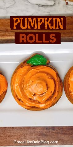 three pumpkin rolls on a white plate with the words pumpkin rolls in front of them