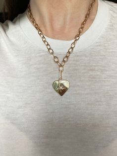 A vintage vibe emanates from this pairing of our Galaxy Heart Pendant and Oval Link Charm Chain. The pendant is hand engraved with a star and accented with your choice of a burnished set Diamond, Ruby, Pink Tourmaline, Blue Sapphire, Turquoise or Emerald. 3.5grams 14kt Gold, Polished Finish .20cts Precious or Semi-Precious Gemstone .5" Elongated Pave Diamond Enhancer (Included) 16" Chain, 1" Pendant Exquisitely Handcrafted in Los Angeles Vintage Vibes, 14kt Gold, Hand Engraving, Pink Tourmaline, Pave Diamonds, Semi Precious Gemstones, Heart Pendant, Blue Sapphire, Tourmaline