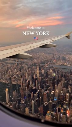 an airplane wing flying over a large city at sunset with the new york skyline in the background