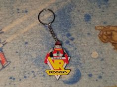 there is a keychain with a cartoon character on it that says vr troopers