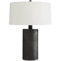 a black table lamp with a white shade