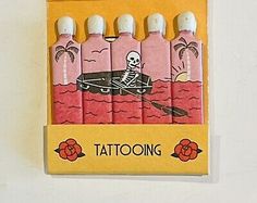 a set of six pink and white lighters with a skeleton in a boat on the water