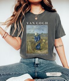 ✿ Unisex Vincent Van Gogh T-Shirt  Our shirt showcases Vincent van Gogh's enchanting masterpiece, "Peasant Woman Binding Sheaves." For the passionate art lover, this wearable artwork captures the rustic charm and timeless beauty of van Gogh's pastoral scenes, inviting you to revel in the simplicity and vitality of rural life. The shirt embodies the ethereal allure of post-impressionist art making it a perfect gift for art teachers and art lovers. T-SHIRT DETAILS We use COMFORT COLORS for our T-s Artsy Short Sleeve T-shirt With Artwork, Graphic Cotton T-shirt With Artwork, Cotton Crew Neck T-shirt With Artwork, Graphic Tee T-shirt For Artistic Expression With Custom Artwork, Cotton Art With Graphic Print For Artistic Expression, Summer Graphic Tee With Custom Artwork, Graphic Tee With Custom Artwork And Relaxed Fit, Relaxed Fit Graphic Tee With Custom Artwork, Custom Artwork T-shirt For Artistic Expression In Summer