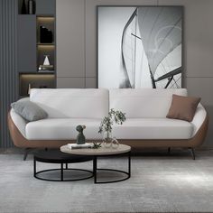 a living room with a white couch and coffee table