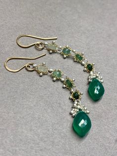 Woven faceted 3mm emeralds with faceted Green Onyx Marquise Briolettes are light weight and fluid.  Our woven earrings are handcrafted and thoughtfully designed to add movement and color that showcase these gemstones and you. *Rare stone setting by torching gems securely into place. *Unique metalwork of kinetic granulation resembling caviar (tiny silver balls torched into place) *Sturdy yet delicate *Rubber backs are included for you to keep them securely on your ears. Understated elegance.  The Elegant Green Briolette Jewelry, Elegant Green Briolette Gemstones, Elegant Faceted Chrysoprase Jewelry, Elegant Faceted Emerald Gemstones, Green Gemstone Dangle Earrings, Elegant Faceted Emerald Jewelry, Emerald Multi-stone Jewelry For May Birthstone, Green Onyx Jewelry With Matching Earrings, Emerald Rondelle Faceted Beads Jewelry