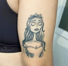 a woman's arm with a tattoo on it that has a drawing of a girl