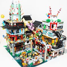 a large lego house with lots of different things on it's front and side