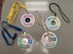 four id badges with lanyards attached to them on top of a plastic tray