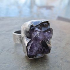 Raw Amethyst Druzy Ring Purple Rough Gemstone Crystal Rustic Silver Ring: Chunky rustic ring of natural raw Amethyst set in sterling silver. I hammered, stamped and distressed the bezel and the band for an organic look. Size is 7.5. 100% handmade by me in all sterling silver in my little home studio. Enter my shop: https://www.etsy.com/shop/artdi Join me on Facebook: https://www.facebook.com/Artdi-Diana-Anton-Jewelry-Design-44805607932/ Find me on Instagram: https://www.instagram.com/dianaantonjewelrydesign/ Elven Witch, Rough Gemstone Jewelry, Witch Rings, Rustic Ring, Raw Stone Jewelry, Rough Jewelry, Raw Crystal Ring, Amethyst Set, Rustic Rings