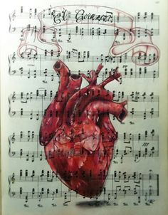 an open book with music notes and a drawing of a heart