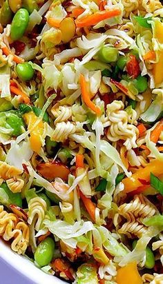 a mixture of noodles and vegetables mixed together