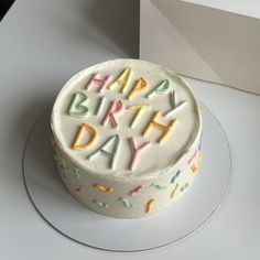 a birthday cake with the words happy birthday written on it