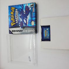 a nintendo wii game box sitting on top of a white wall next to a plastic object