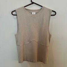 Abercrombie & Fitch Xl Tan Sweater Tank Never Worn. Super Soft, Thick Sweater Material. Sleeveless Relaxed Fit Top For Fall, Khaki Sleeveless Top For Layering, Sleeveless Khaki Top For Layering, Oversized Sleeveless Tops For Fall, Khaki Winter Loungewear Tops, Spring Khaki Tops For Loungewear, Sleeveless Knit Tops With Relaxed Fit, Stretch Khaki Tops For Loungewear, Sporty Khaki Tops For Spring