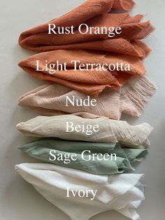 four different colors of scarves with names on them