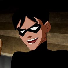 an animated image of a man wearing a batman mask and holding a cell phone in his hand