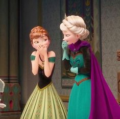 two frozen princesses standing next to each other with their hands on their mouths and looking at each other