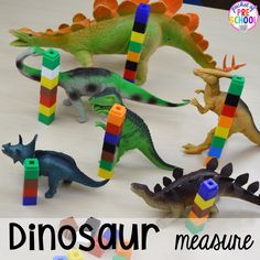 the dinosaurs are playing with legos to make them look like they're trying to learn