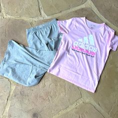 Nwt Adidas, 2-Piece Set, Shirt & Flare Pants, Size M 10/12 Colors: Pink & Gray Pink, Short Sleeve, Shirt Has “Adidas” Design On Front In White, Pink & Gray. Pants Are Gray, Elastic Waistband, Has Adidas Logo On Front In White. Content: Top: 56% Cotton | 44% Polyester Bottom: 95% Cotton | 5% Elastane Retail $19.97 Casual Stretch Sets For Playwear, Casual Adidas Sets For Spring, Adidas Pink Sets For Spring, Casual Stretch Pink Sets, Casual Pink Matching Set Bottoms, Pink Stretch Cotton Sets, Casual Pink Bottoms Matching Set, Sporty Pink Sets For Spring, Stretch Pink Cotton Sets