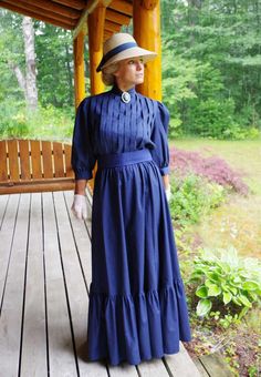 Classic Edwardian styled cotton very versatile 3-piece set! The blouse has shoulder to hem vertical pleating, 3/4 length full sleeves gathered to a cuff, button back, and center front split turn back collar. The skirt has a wide flounce with an elastic waist. The waist is wrapped with a matching cotton belt. Designed and made by Recollections in America. 100% cotton. Hand or machine wash cold gently; hang or tumble dry low. Leisa is wearing a brooch, hat, gloves, and boots and they are priced se Cotton Victorian Dress For Formal Occasions, Elegant Prairie Dress With Gathered Sleeves For Daywear, Cotton Victorian Long Sleeve Dress For Fall, Long Sleeve Cotton Victorian Dress For Fall, Fall Victorian Long Sleeve Cotton Dress, Long Sleeve Prairie Dress For Daywear, Elegant Prairie Dress For Fall Daywear, Classic Fitted Long Sleeve Prairie Dress, Fitted Long Sleeve Prairie Dress With Gathered Sleeves