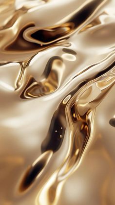 an abstract image of gold and black liquid