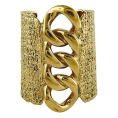 YVES SAINT LAURENT massive textured gold tone cuff bracelet featuring a large rigid chain design on the front. Embossed YVES SAINT LAURENT. Indicative measurements : min. inner width approx. 6 cm (2.36 inches) / max. inner width approx. 6.9 cm (2.72 inches) / inner height approx. 5.1 cm (2 cm) / max. length approx. 8.8 cm (3.46 inches) / cuff opening approx. 3.8 cm (1.50 inches). Material : Gold tone metal hardware. NOTES - This is a preloved vintage item, therefore it might have imperfections. Gold Cuff Bracelets, Bronze Cuff Bracelet, Arm Cuff Bracelet, Antique Bracelets, Gold Bracelet Cuff, Chain Design, Diamond Gold, Gold Collection, Gold Texture