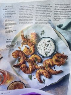 a plate with shrimp on it next to some dipping sauce