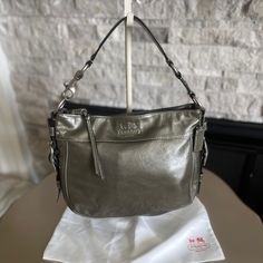 Nwot Coach Zoe Purse Shoulder Bag With Dustbag Gray / Green 4"W X 12" X 9"H Smoke And Perfume Free Home Designer Rectangular Hobo Bag With Silver-tone Hardware, Designer Handheld Hobo Bag, Coach Shoulder Bag With Silver-tone Hardware, Luxury Hobo Satchel Bag With Silver-tone Hardware, Designer Rectangular Hobo Bag With Branded Hardware, Classic Silver Bags With Gold-tone Hardware, Designer Hobo Bag With Silver-tone Hardware For Shopping, Designer Coach Shoulder Bag With Branded Hardware, Designer Coach Hobo Bag