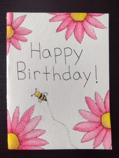 a happy birthday card with pink daisies and a bee flying towards the flowers on it