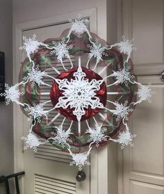 a snowflake hanging from the side of a door