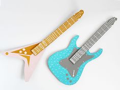 an image of two guitars made out of paper