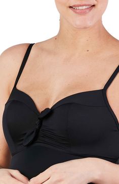 A built-in bra provides extra support in a sleek one-piece swimsuit designed with bump-flattering ruching at the sides and adjustable ties at the back. Ties at back Full back coverage Adjustable straps UPF 50+ sun protection Partially lined 64% nylon, 16% spandex, 14% polyester Hand wash, line dry Imported OEKO-TEX®–certified materials free of harmful substances Black Spaghetti Strap Swimwear With Tie Back, Elegant Black Underwire Tankini, Black Tie Back Tankini For Pool, Beachwear Tankini With Tie Back And Underwire, Beachwear Underwire Tankini With Tie Back, Elegant Solid Swimwear With Removable Bra Pads, Solid Underwire Tankini With Removable Bra Pads, Black Tankini With Padded Underwire Cups, Poolside Underwire Tankini With Tie Back