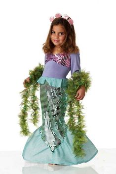 This item is shipping from beautiful Los Angeles county, CA. This mermaid is ready for an undersea adventure. The Lil' Mermaid toddler costume is a sequined dress that comes with a seashell headband. Wig not included. Includes: Mermaid Dress, Seashells Headband Not Included: Seaweed Boa Sold Separately. Arial Mermaid, Mermaid Costume Toddler, Toddler Mermaid Costumes, Scary Mermaid, Mermaid Costume Kids, Mermaid Halloween Costume, Girls Mermaid Costume, Mermaid Halloween Costumes, Mermaid Costumes