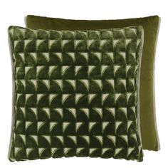 two green velvet pillows with geometric designs on them, one is square and the other is rectangleed