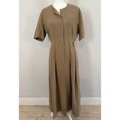 This Jenni Kayne Dress Is A Must-Have For Any Wardrobe. Made Of 100% Linen, This Day Dress Features A Solid Pattern In A Beautiful Khaki Brown Color. The Short Sleeve Shirt Dress Has A Button Closure And A Maxi Length, Making It Perfect For Any Occasion, Whether It Be Casual, Business, Party, Or Travel. The Dress Also Includes A Pocket And Is Machine Washable For Easy Care. It's A Classic Designer Piece That Will Never Go Out Of Style And Is Suitable For Women Of All Sizes. Excellent Condition, Brand Label Has Been Cut Out (See Pic), No Stains, Rips, Or Holes. Bust - 34 In Waist - 27 In Msrp - $395 Jenni Kayne Dress, Short Sleeve Shirt Dress, Business Party, Jenni Kayne, Short Sleeve Dress Shirt, Brown Shorts, Brand Label, Day Dress, Short Sleeve Button Up