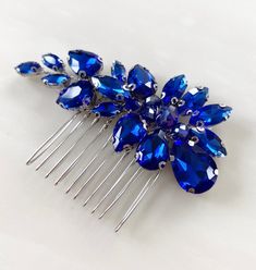 A stunning royal blue and silver bridal and occasion hair comb with beautiful faceted crystals.  Introducing our Crystal Hair Comb - a sparkling accessory that brings elegance to your hair, perfect for any occasion. Our comb is adorned with shimmering crystals that catch the light, adding a touch of glamour to your look. It's versatile and complements various hairstyles, whether you wear your hair up or down.  It comes in a beautifully packaged, making it an ideal gift for friends, bridesmaids, Wedding Jewelry Royal Blue, Royal Blue Crystal Jewelry For Party, Royal Blue Hair Accessories, Elegant Blue Hair Accessories For Formal Occasions, Elegant Blue Hair Accessories For Evening, Royal Blue Hair, Blue Hair Accessories, Occasion Hair, Hair Up Or Down