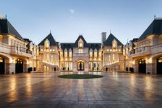 a large building with lots of windows and lights