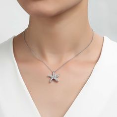 Fun and stylish. This starfish necklace is set with 1.01 carats total weight of Lafonn's signature Lassaire simulated diamonds in sterling silver bonded with platinum. The pendant comes on an adjustable 20" chain. Pendant measures approximately 0.75 inches from top to bottom and just over a 0.75 inches wide at widest point Includes pendant box Ships fully insured to point of delivery Elegant Starfish Necklace For Gift, Elegant Starfish Charm Pendant Jewelry, Elegant Starfish Charm Jewelry For Gifts, Elegant Starfish Charm Jewelry As Gift, Elegant Starfish Charm Jewelry Gift, Elegant Star-shaped Jewelry With Starfish Charm, Elegant Jewelry With Starfish Charm, Elegant Pendant With Starfish Charm, Elegant Silver Starfish Jewelry