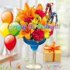 happy birthday card with colorful flowers and balloons in a glass vase next to a gift box