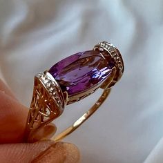 Gorgeous Vintage Ring In Solid 10k Yellow Gold (Stamped And Tested) , With Beautiful Genuine Amethyst Stone And Tiny Tiny Diamond Chips That Add Some Sparkle When Hand Is Moved. The Main Stone Is Approx. 10mm Long By 6mm Wide . The Ring Is A Tiny Bit Shy Of A Size 7.75 On Ring Mandrel, Weights 2.4 Grams. Really Well Made, Versatile Piece Of Jewelry That Totally Looks Like A Designer Made Piece!!!! Amethyst Vintage Ring, Amethyst And Diamond Engagement Ring, Amethyst Rings, Antique Yellow Gold Amethyst Ring, Luxury Vintage Gold Amethyst Ring, Vintage 14k Gold Amethyst Ring Hallmarked, Luxury Yellow Gold Victorian Amethyst Ring, Engagement Wishes, Vintage 14k Gold Multi-stone Amethyst Ring